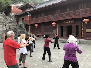 people practicing tai chi at purple cloud temple