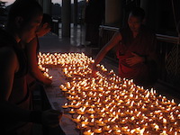 monks and burning candles