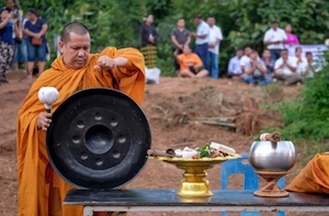 monk holds praying ceremony