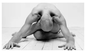 man doing yoga on floor
